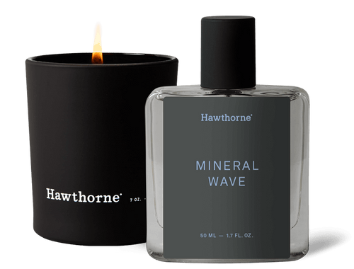 The Hawthorne Mineral Wave Cologne with its sleek black cap and gray label pairs beautifully with the lit Aquatic Candle, capturing the endless summer vibe.