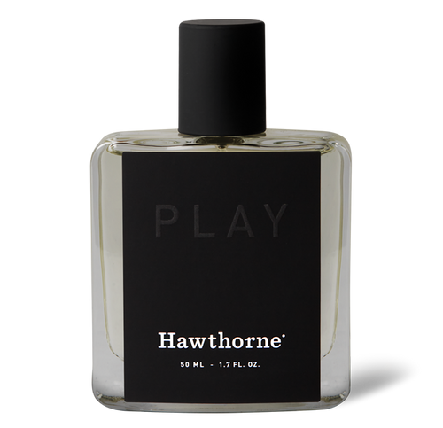 A clear glass bottle of hawthorne Botanic Blur Play Cologne with a black cap and label, containing 50 ml (1.7 fl oz) of fragrance.