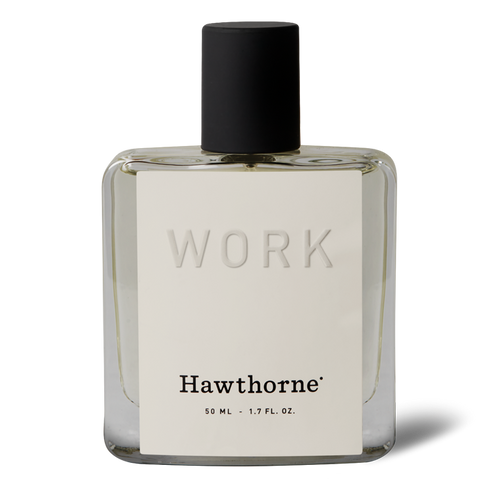 The Citrus and Woody Work Cologne by hawthorne is a clear glass bottle labeled WORK, featuring 50 ml (1.7 fl. oz.) of citrus fragrance with notes of grapefruit and vetiver, topped with a sleek black cap.