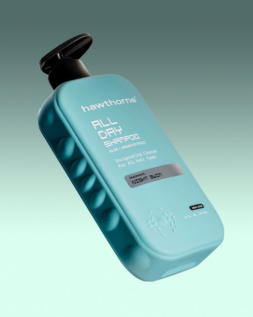A blue bottle of Hawthorne All Day Shampoo, formulated for deep cleansing and hydration for all hair types, is displayed against a gradient green background.