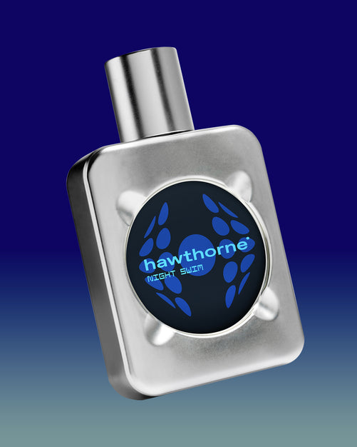 A rectangular metallic bottle with a round black label reading hawthorne NIGHT SWIM in blue text, set against a blue gradient background.